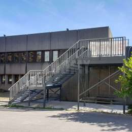 Exterior metal fire escape stair for office building Metal stairs outside of an office building for emergency evacuation